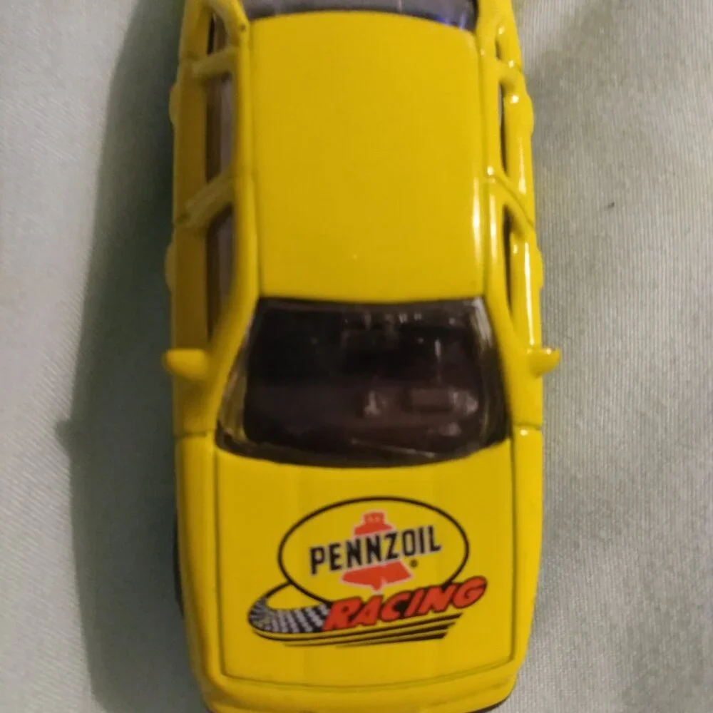 2002 Golden Wheel and 2004 Hot Wheels car
